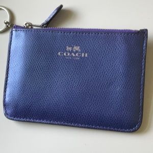 Coach coin wallet with key chain.  Their is two compartments inside.